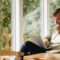 This image shows a man looking at his laptop.